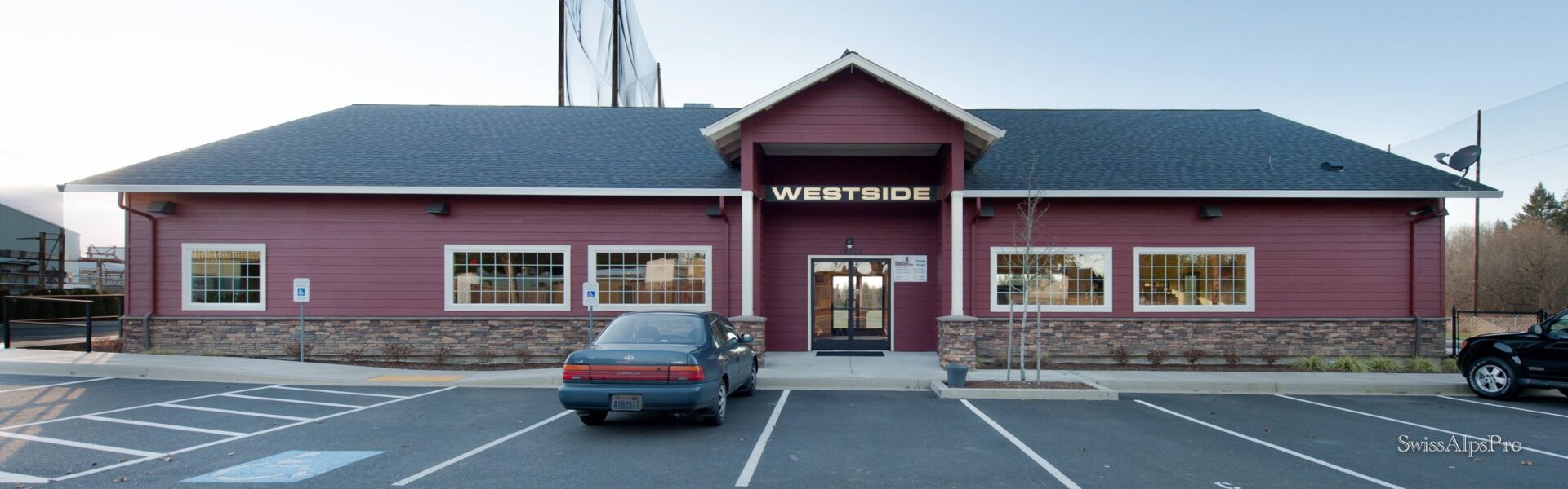 Westside storefront with parked car
